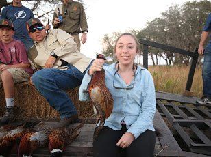 A hunter with a bobwhite quail on the rig